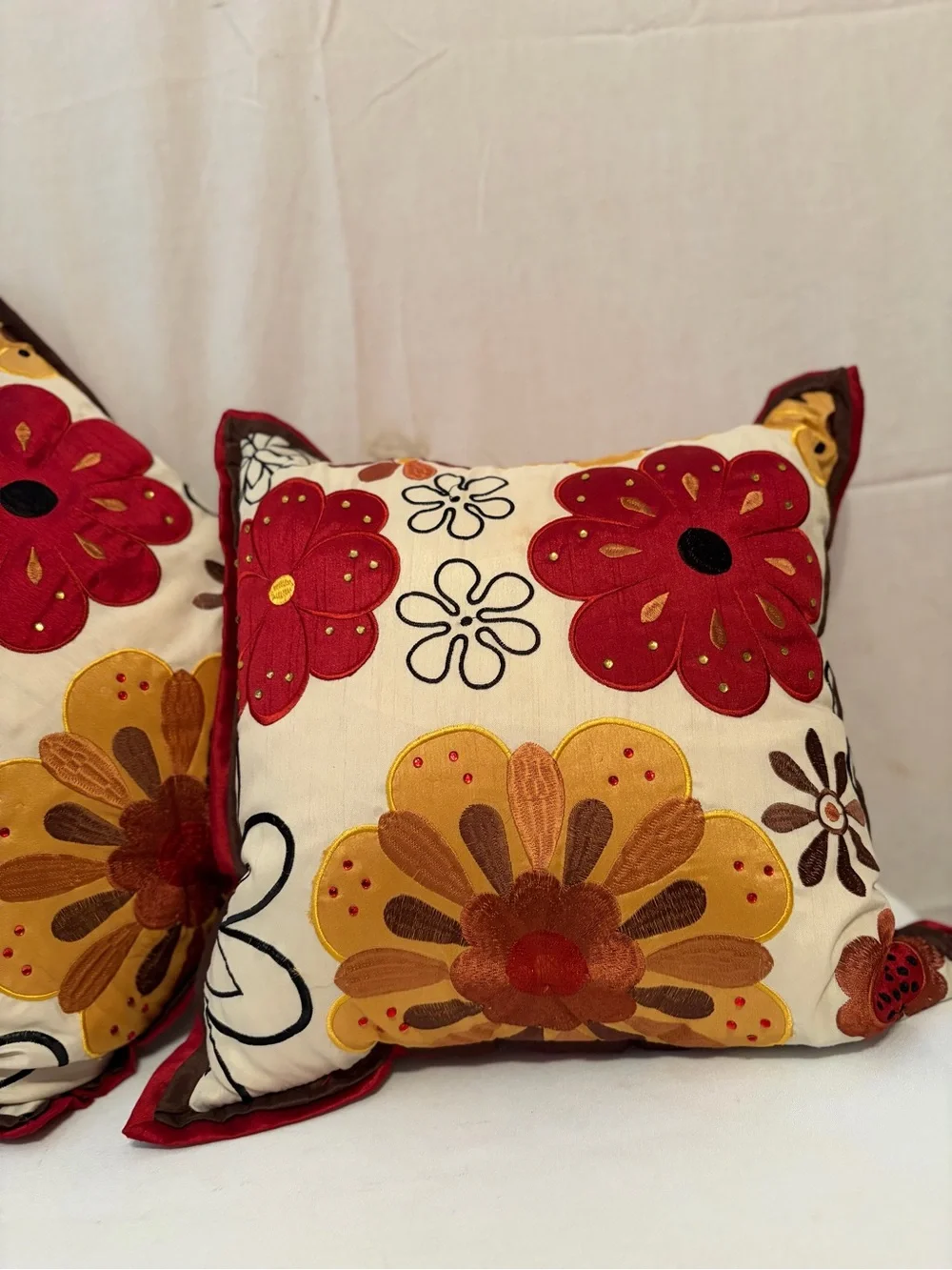 Pier 1 Imports pillows vibrant floral embroidery in red and gold
